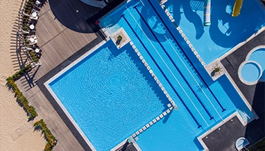 Hotel pool viewed from above, maintained through a customized service plan by Commercial Pool Kings.