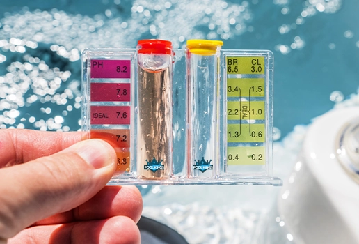 Technician performing pool water pH testing during chemical balance service by Commercial Pool Kings.